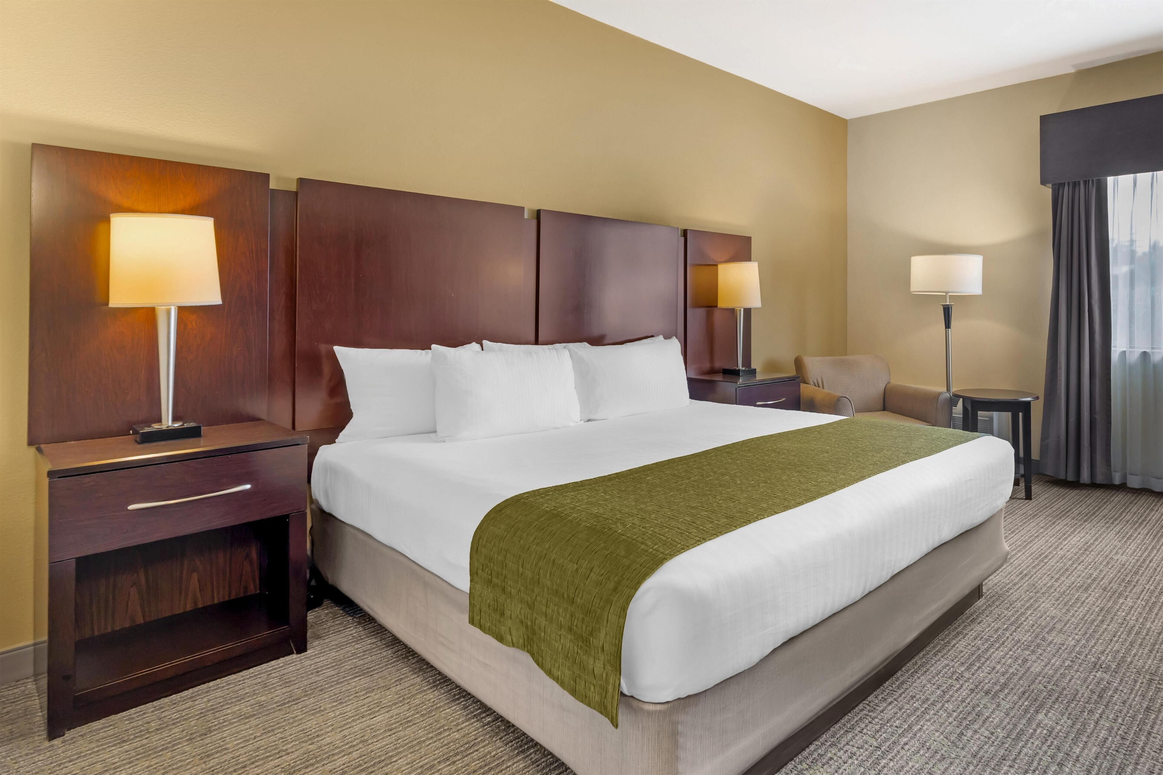 Premium bedding, desk, laptop workspace, iron/ironing board