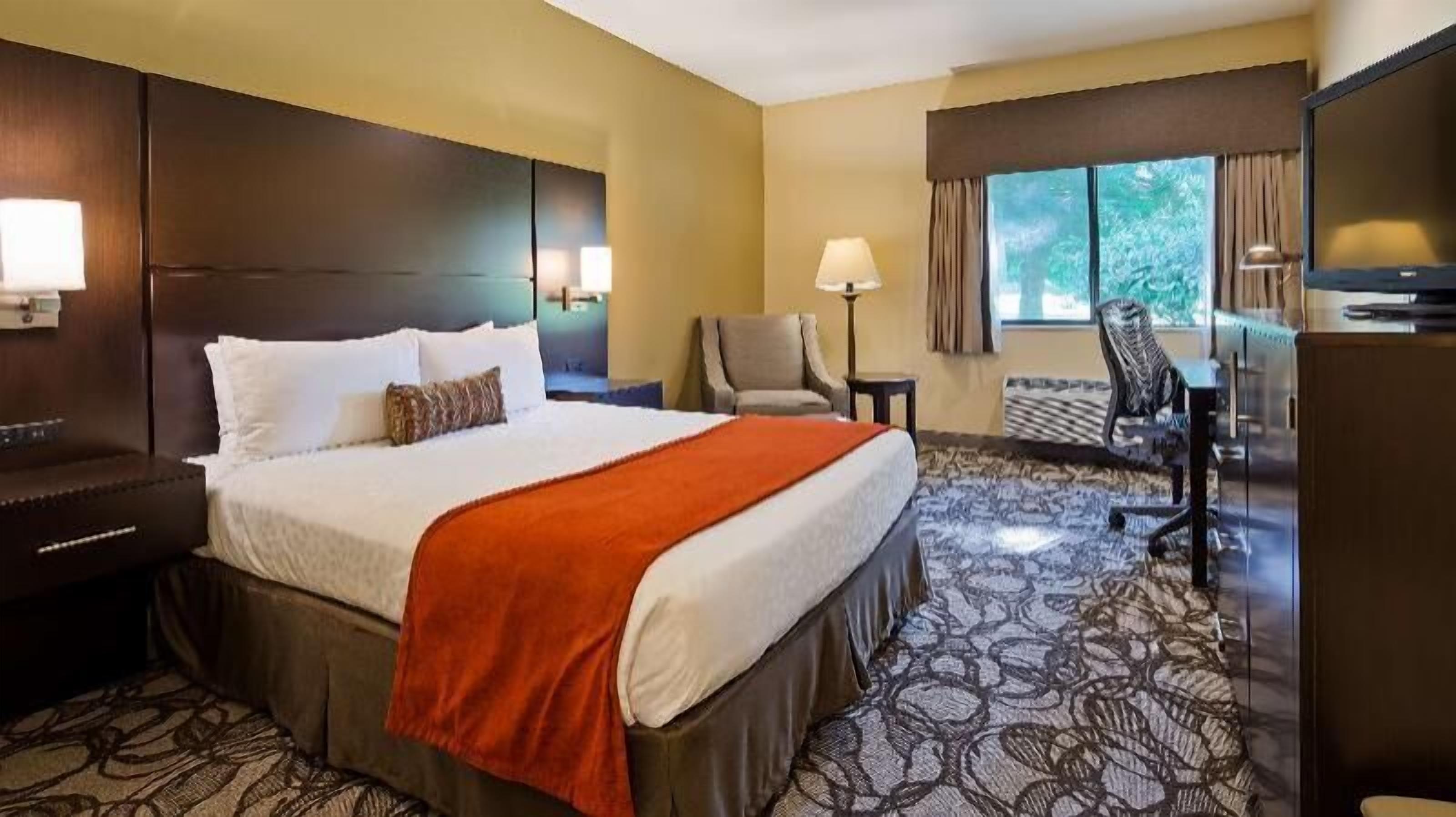 Premium bedding, desk, laptop workspace, iron/ironing board