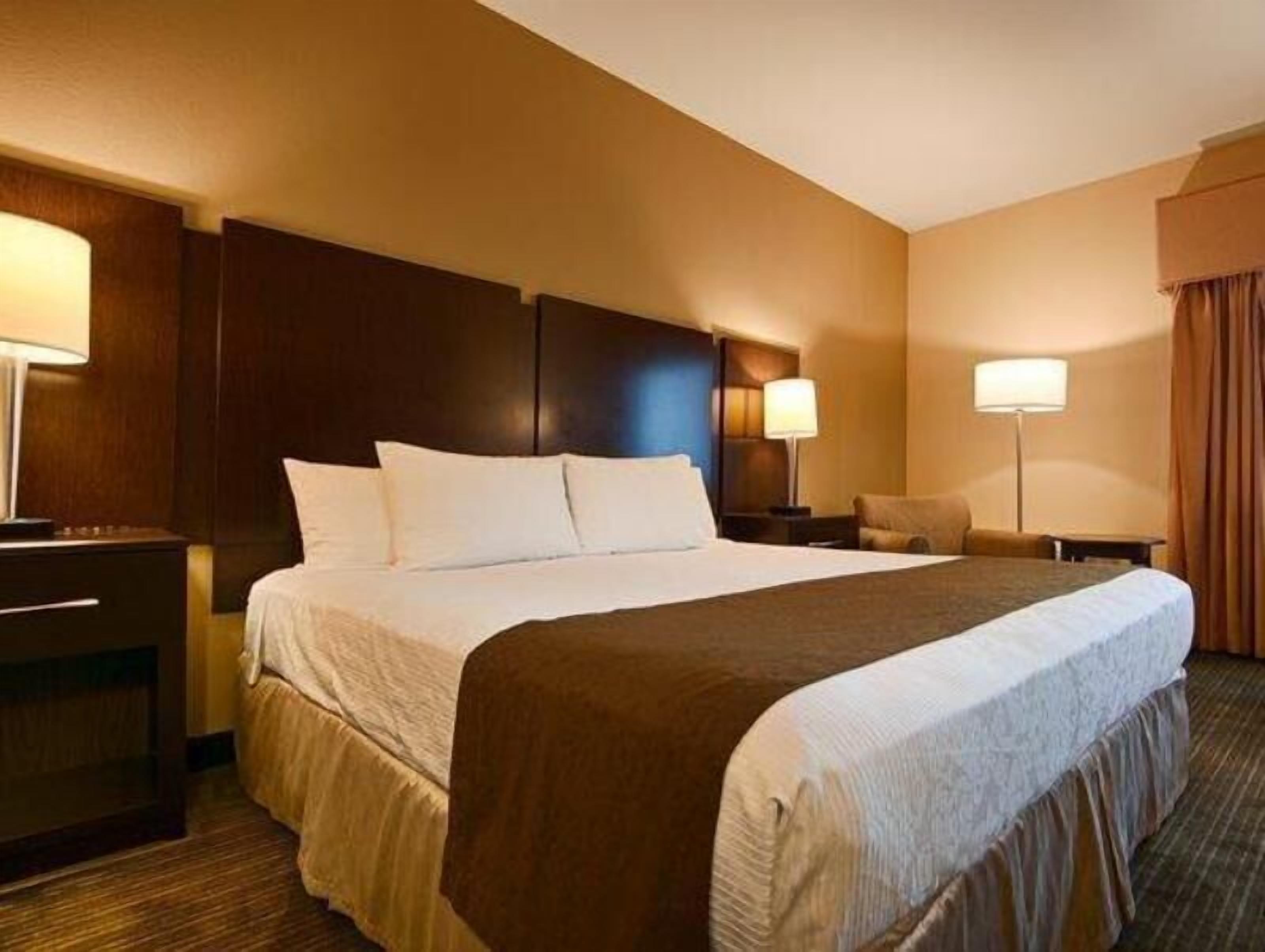 Premium bedding, desk, laptop workspace, iron/ironing board