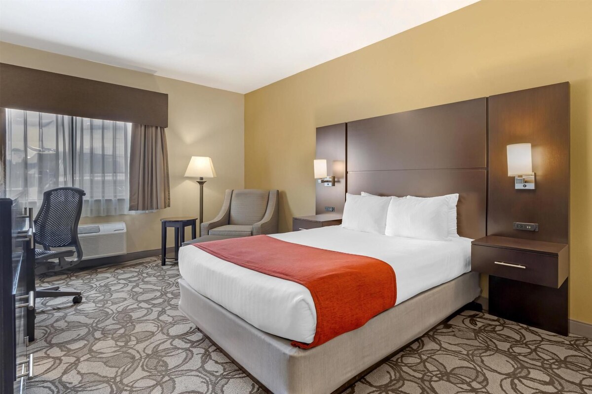 Premium bedding, desk, laptop workspace, iron/ironing board