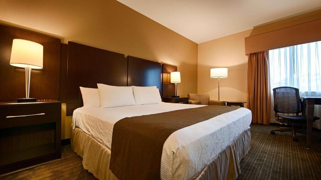 Premium bedding, desk, laptop workspace, iron/ironing board