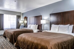 Pillowtop beds, desk, blackout drapes, iron/ironing board