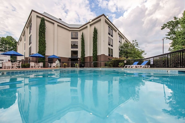 Seasonal outdoor pool, open 9:00 AM to 10:00 PM, pool umbrellas