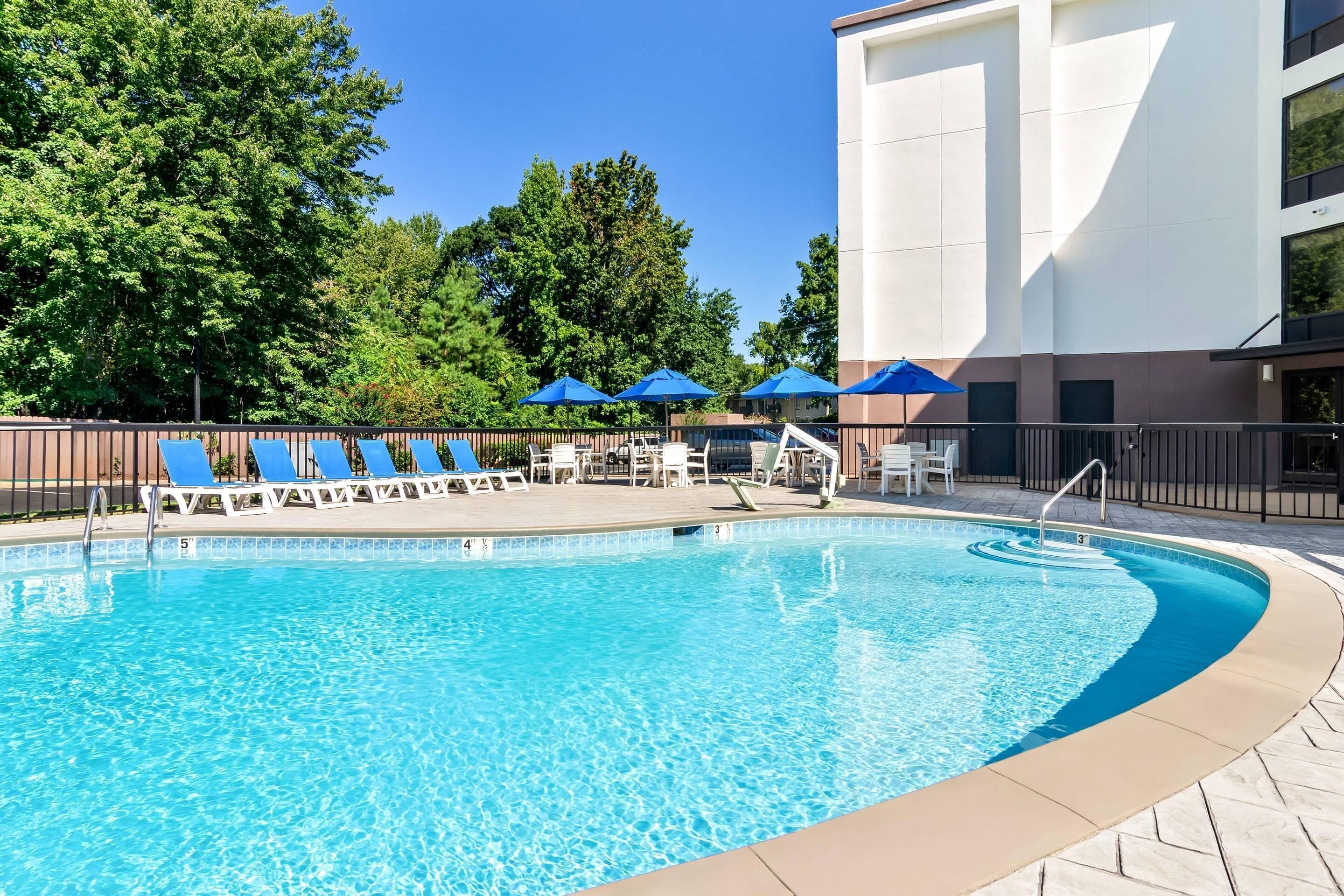 Seasonal outdoor pool, open 9:00 AM to 10:00 PM, pool umbrellas