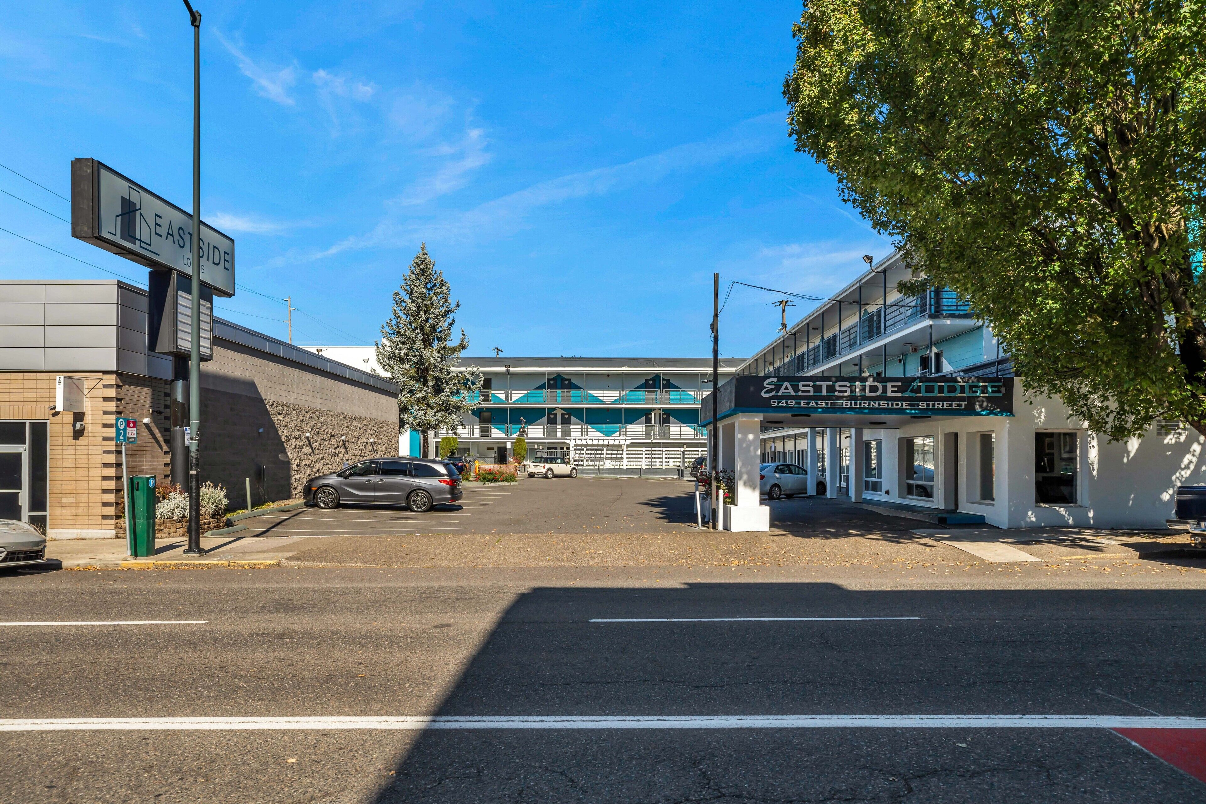 A street view with a building labeled 'EASTSIDE LOFTS' and '945 EAST BURNSIDE STREET'.