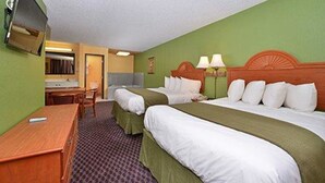 A hotel room with two beds, a desk, a chair, and a television. - Quality Inn & Suites Grinnell near University (Grinnell)