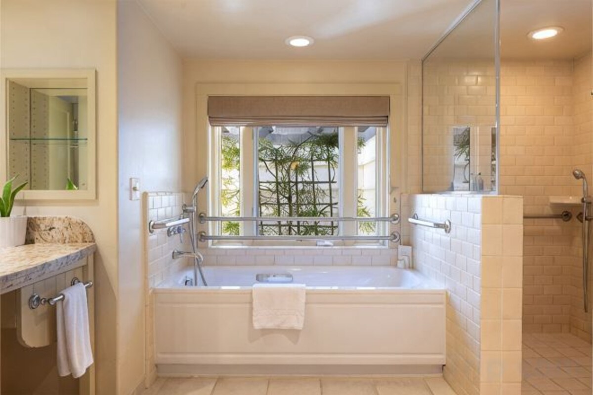 Bathroom | Designer toiletries, hair dryer, bathrobes, slippers