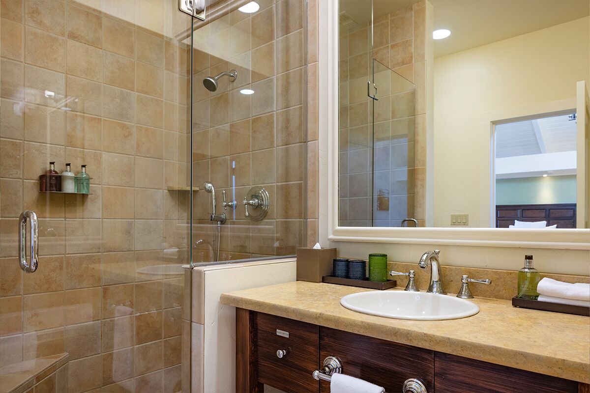 bungalow deluxe double queen | bathroom | designer toiletries, hair dryer, bathrobes, slippers