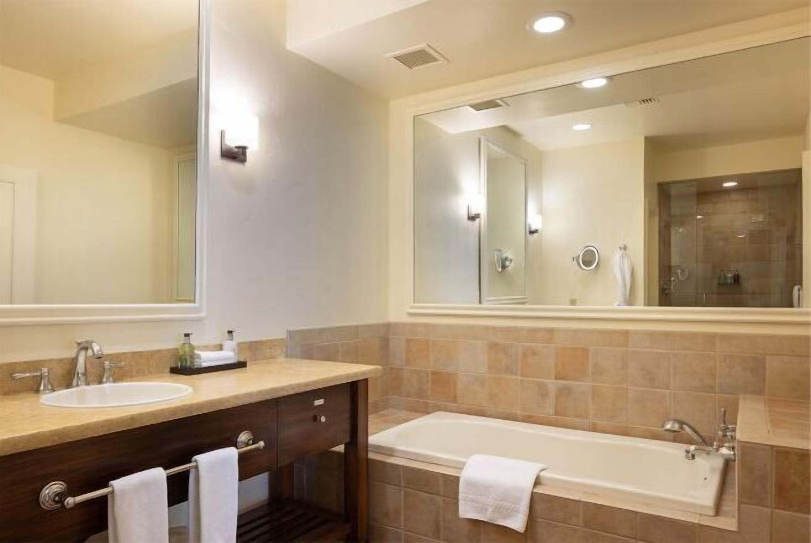 Bathroom | Designer toiletries, hair dryer, bathrobes, slippers