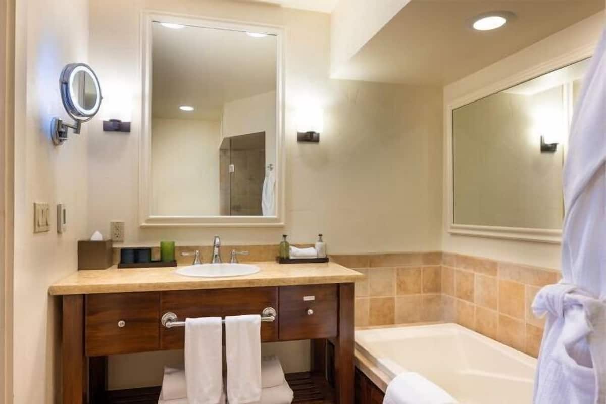 Bathroom | Designer toiletries, hair dryer, bathrobes, slippers