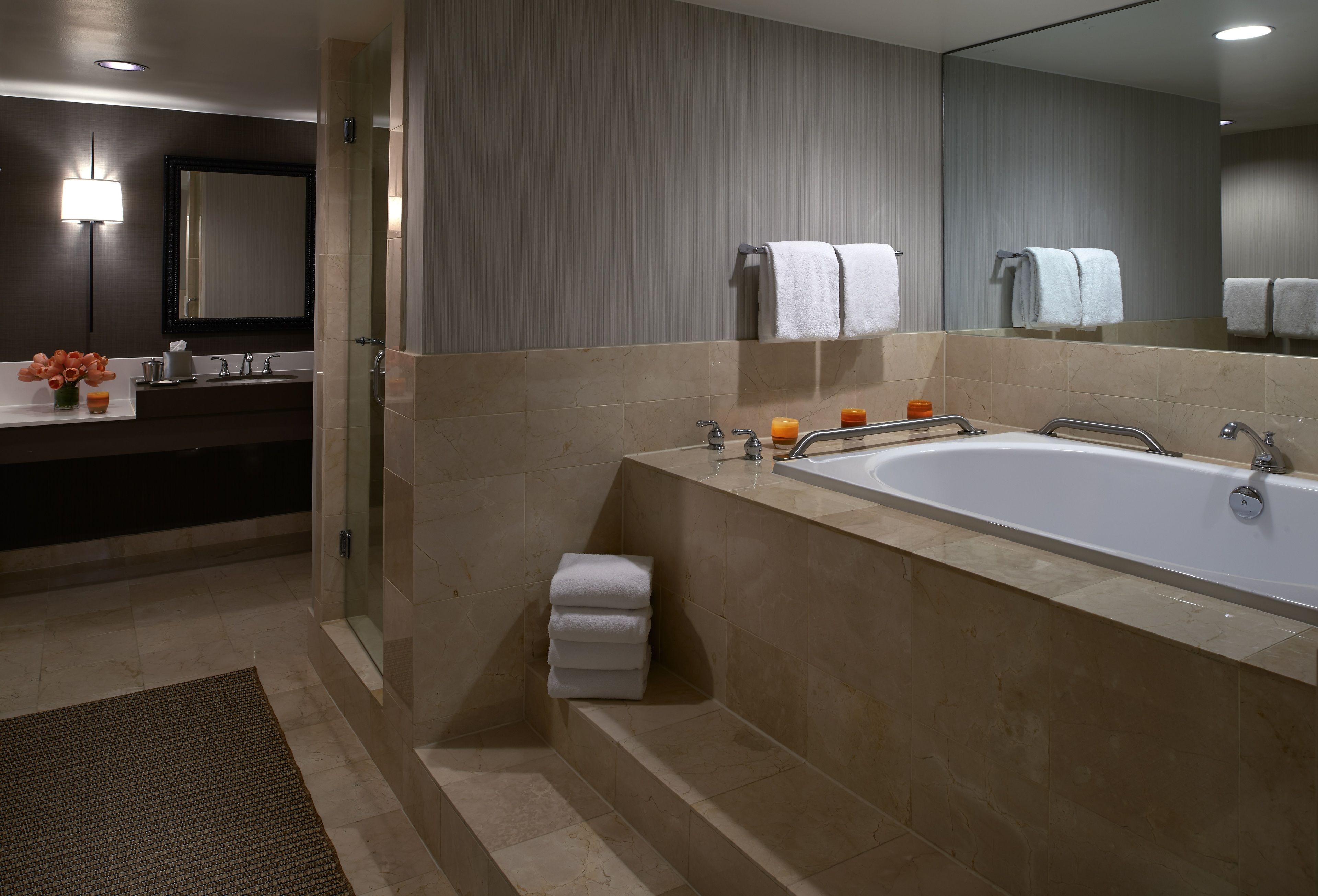 luxury suite | bathroom | combined shower/bathtub, designer toiletries, hair dryer, bathrobes