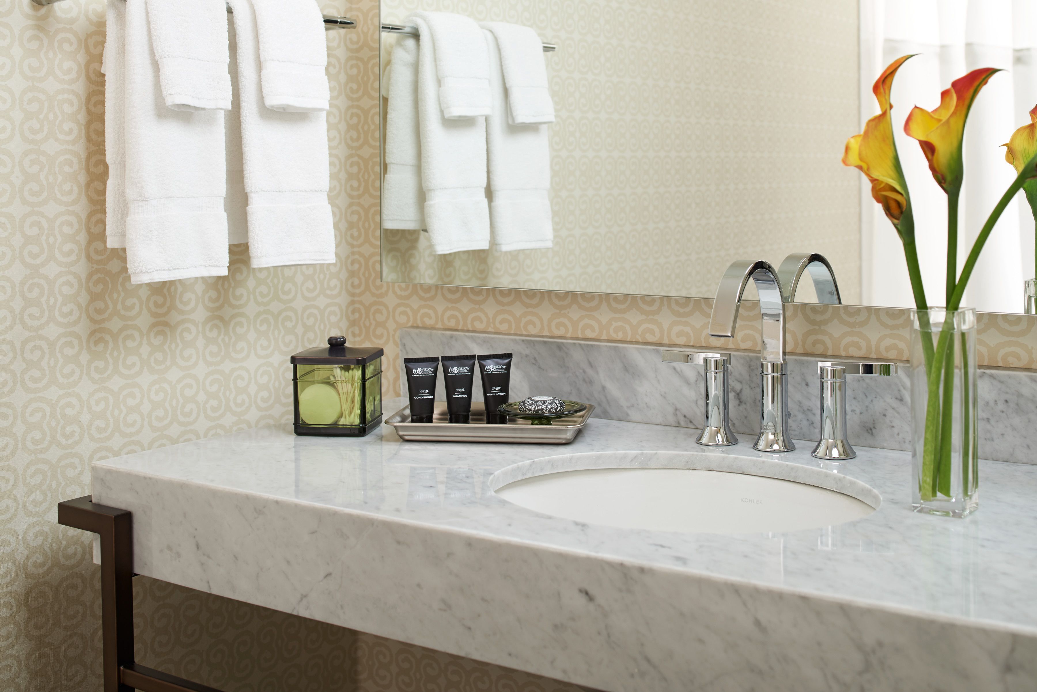 combined shower/bathtub, designer toiletries, hair dryer, bathrobes