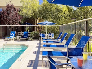 Outdoor pool, open 9:00 AM to 9:00 PM, pool loungers