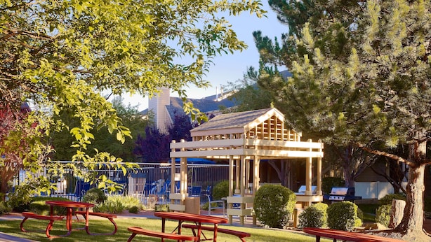 A gazebo with picnic tables in a park area. - Sonesta ES Suites Flagstaff (Flagstaff)
