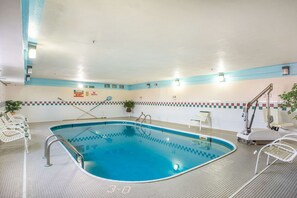 An indoor swimming pool with clear lane markings, a lifeguard chair, and a pool ladder. - Econo Lodge Princeton (Princeton)