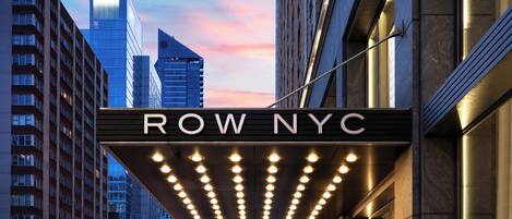 A theater marquee with 'ROW NYC' and a row of lights.