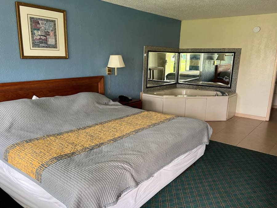 Room, 1 King Bed, Smoking, Jetted Tub | Desk, iron/ironing board, free WiFi, bed sheets