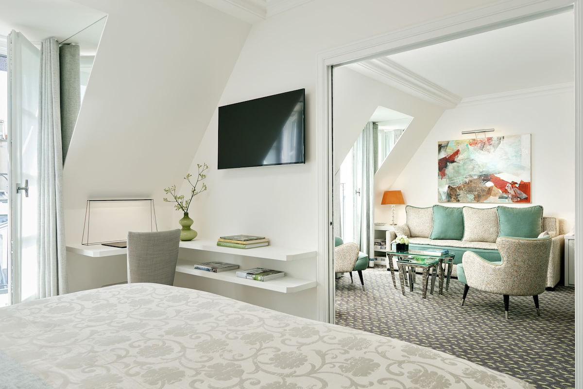 superior suite | living area | 108-cm led tv with satellite channels, tv, tablet