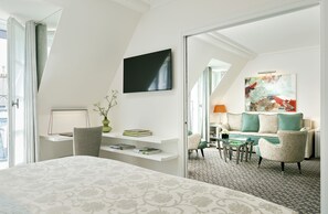 Superior Suite | Living area | 108-cm LED TV with satellite channels, TV, tablet - Le Burgundy Paris (Paris)