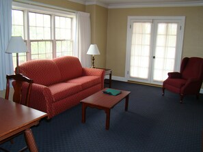 32-inch flat-screen TV with cable channels, TV - Senate Luxury Suites (Topeka)