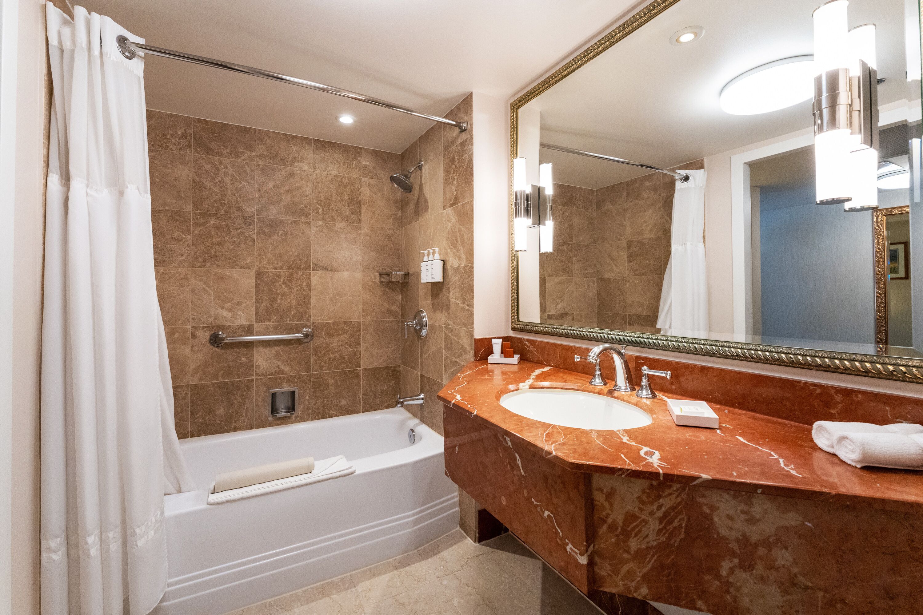 designer toiletries, hair dryer, bathrobes, towels