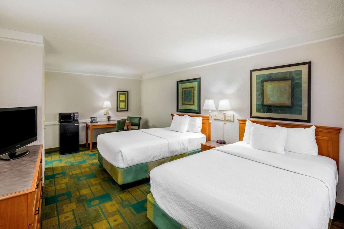 Premium bedding, pillow-top beds, desk, blackout curtains