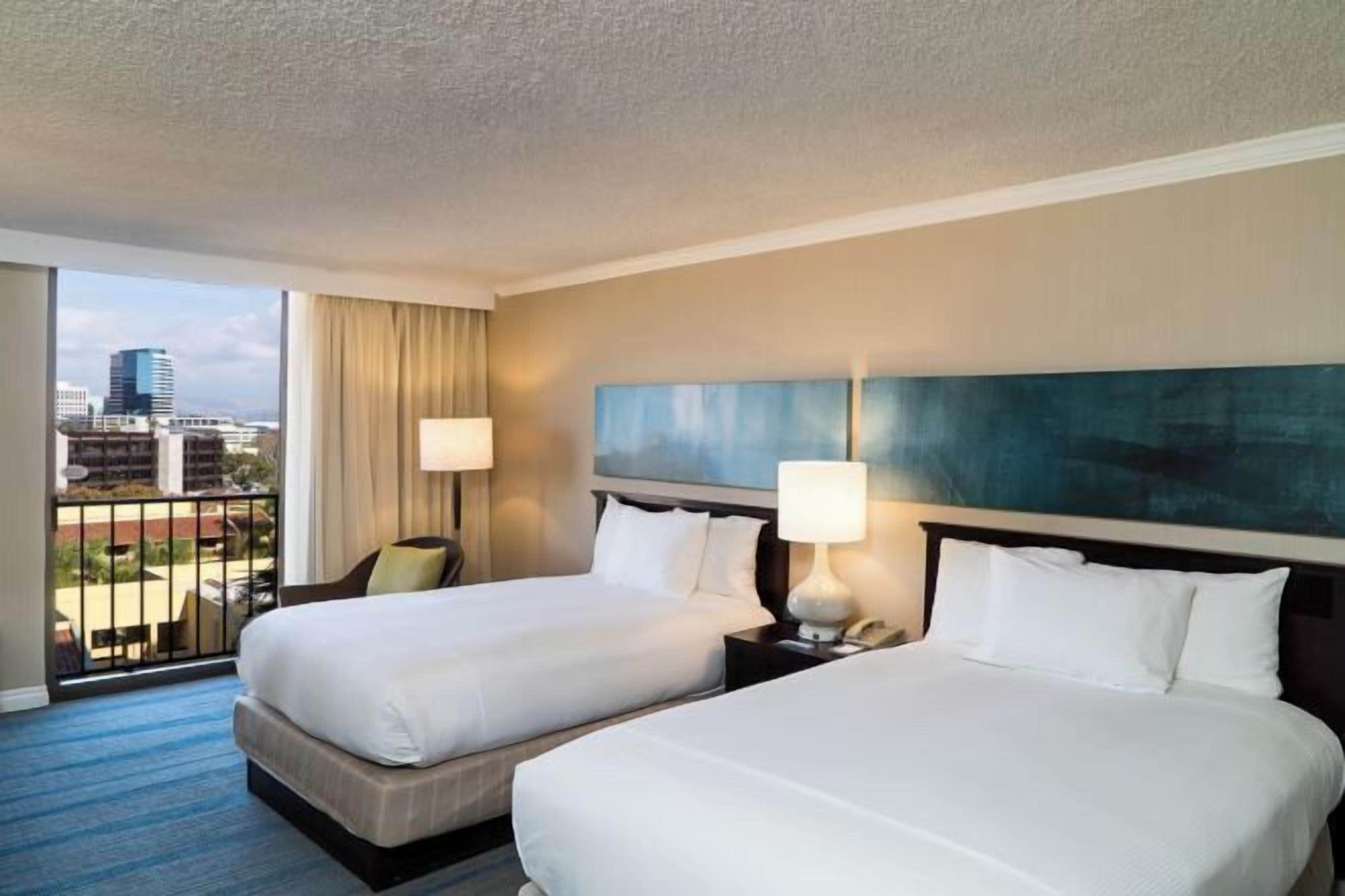 Premium bedding, pillow-top beds, in-room safe, desk