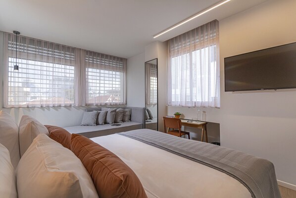 Habitación Premium con 1 cama matrimonial o 2 individuales | Ropa de cama hipoalergénica y caja de seguridad en la habitación 