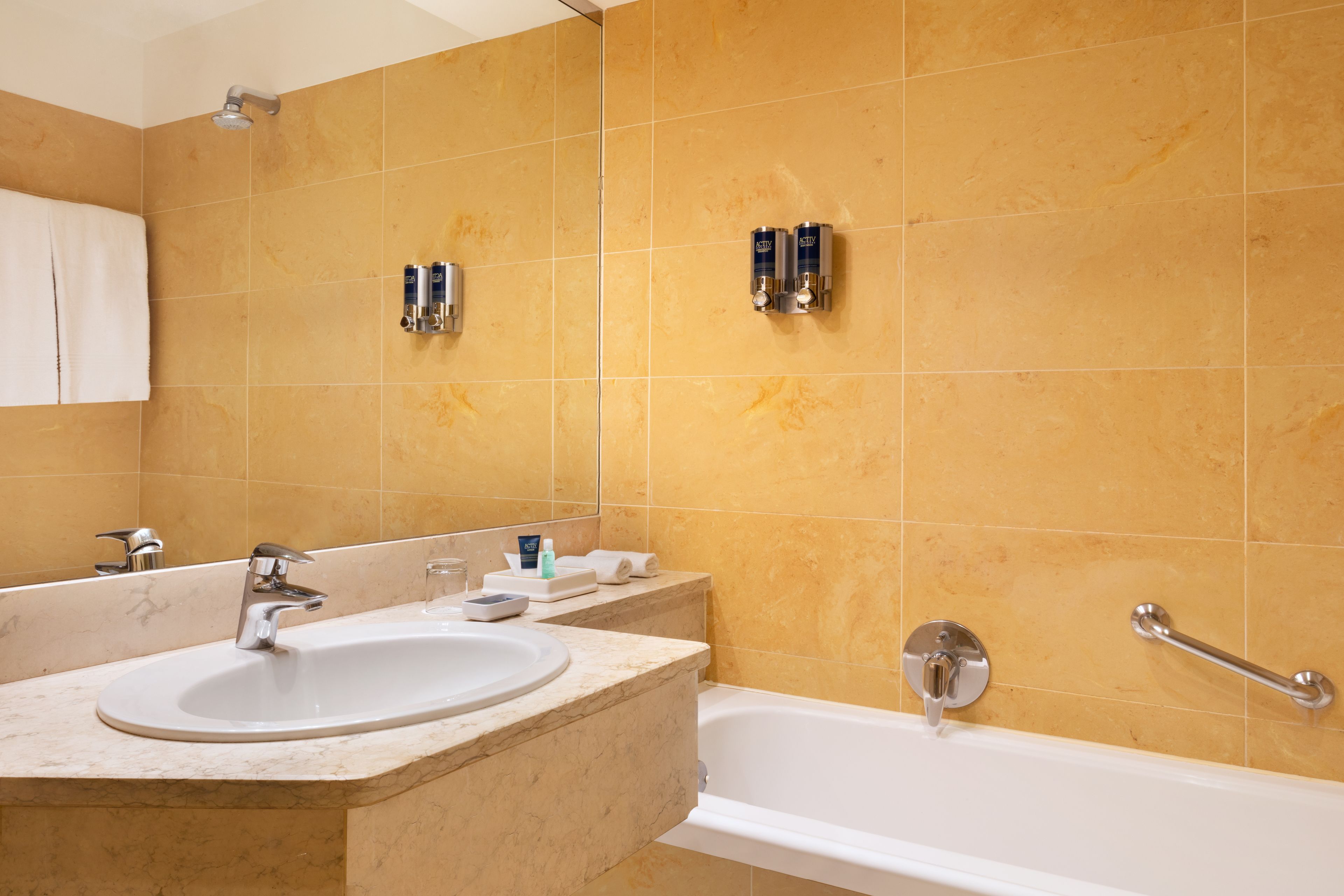 deep-soaking bathtub, rainfall showerhead, free toiletries, hair dryer