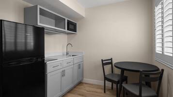 Room, 2 Queen Beds, Non Smoking, Kitchenette | Blackout drapes, iron/ironing board, free WiFi, bed sheets