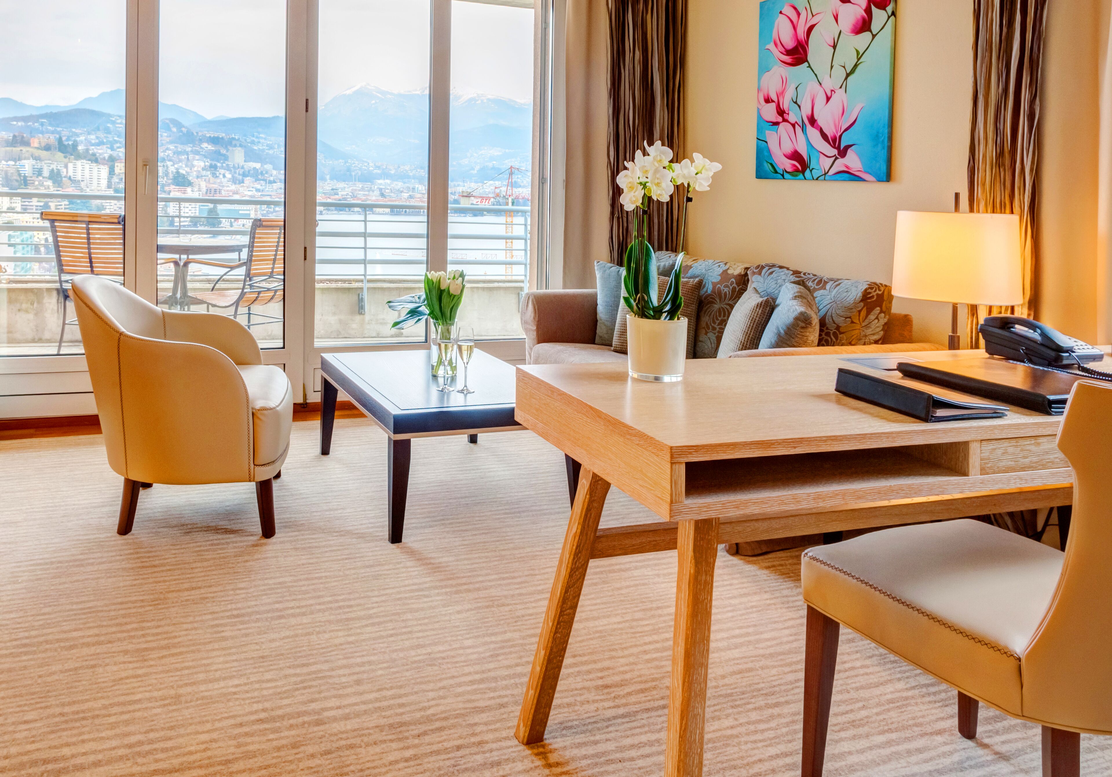 suite, 1 bedroom, lake view | living room | flat-screen tv, dvd player, heated floors