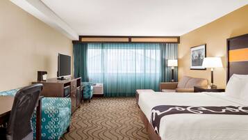 Premium bedding, desk, laptop workspace, iron/ironing board