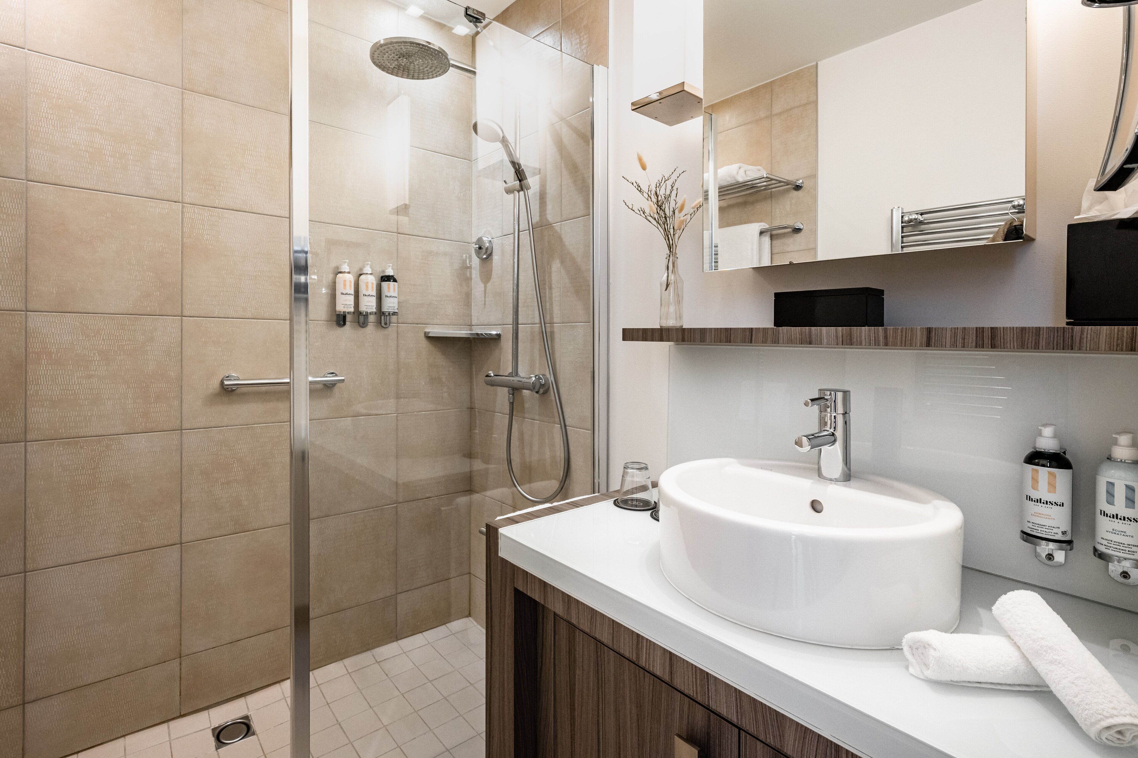 rainfall showerhead, designer toiletries, hair dryer, bathrobes