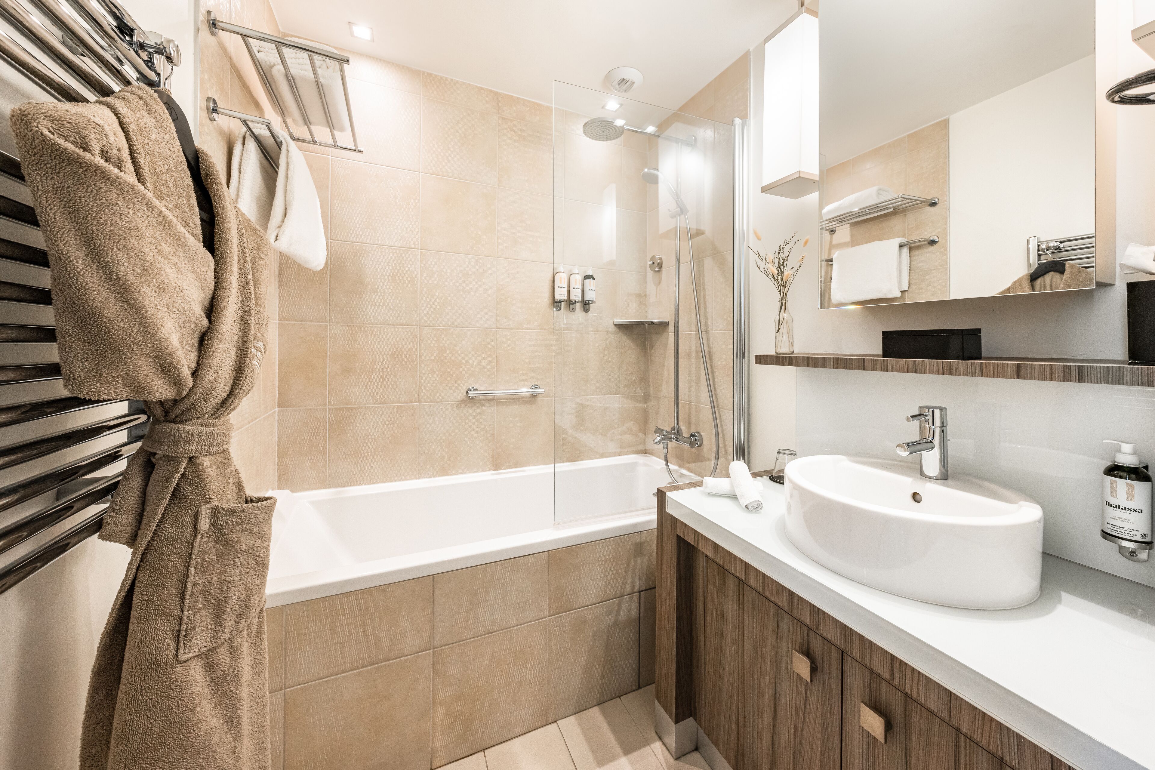 rainfall showerhead, designer toiletries, hair dryer, bathrobes