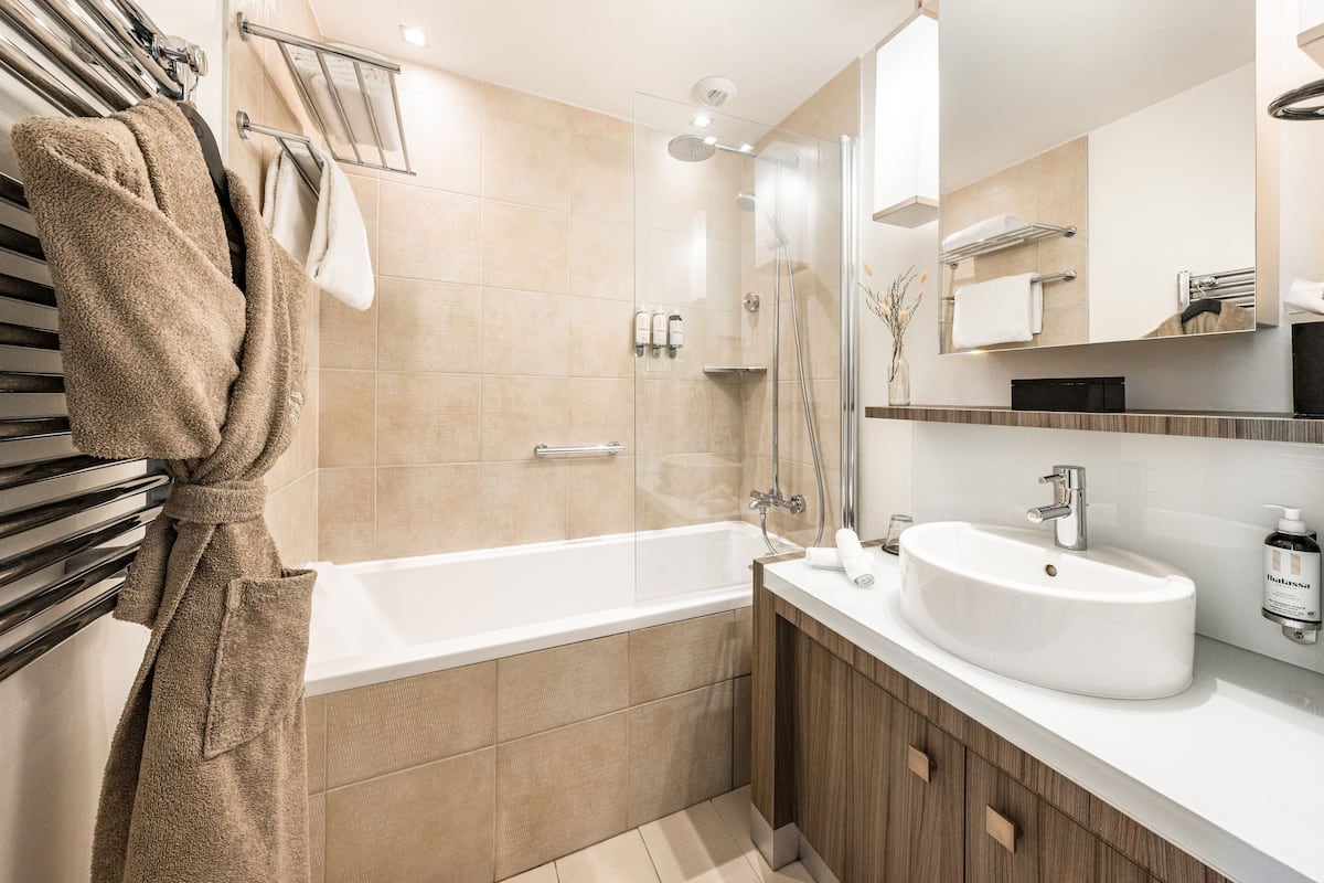 rainfall showerhead, designer toiletries, hair dryer, bathrobes