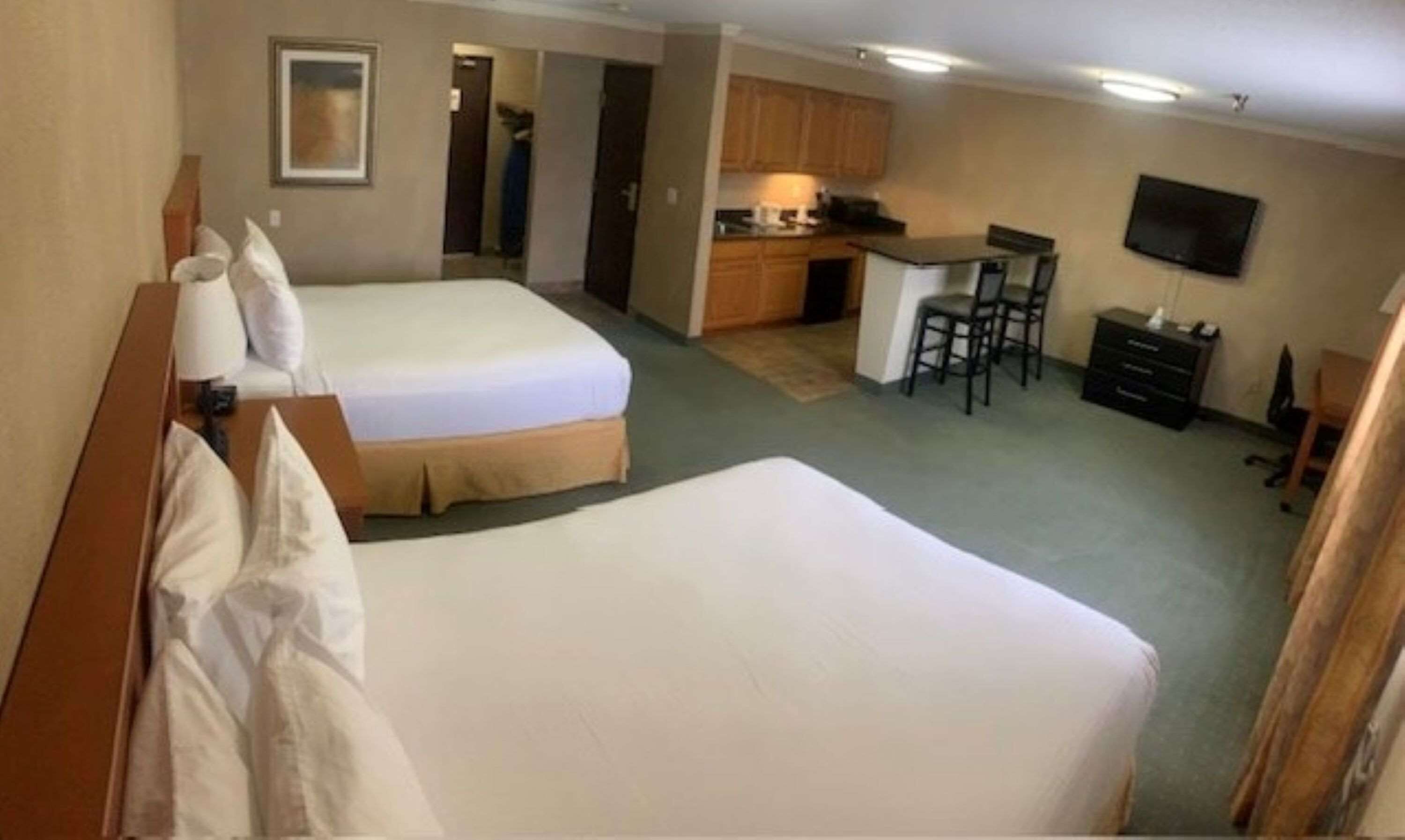 suite, 2 queen beds, non smoking, refrigerator & microwave | 1 bedroom, pillow-top beds, desk, laptop workspace