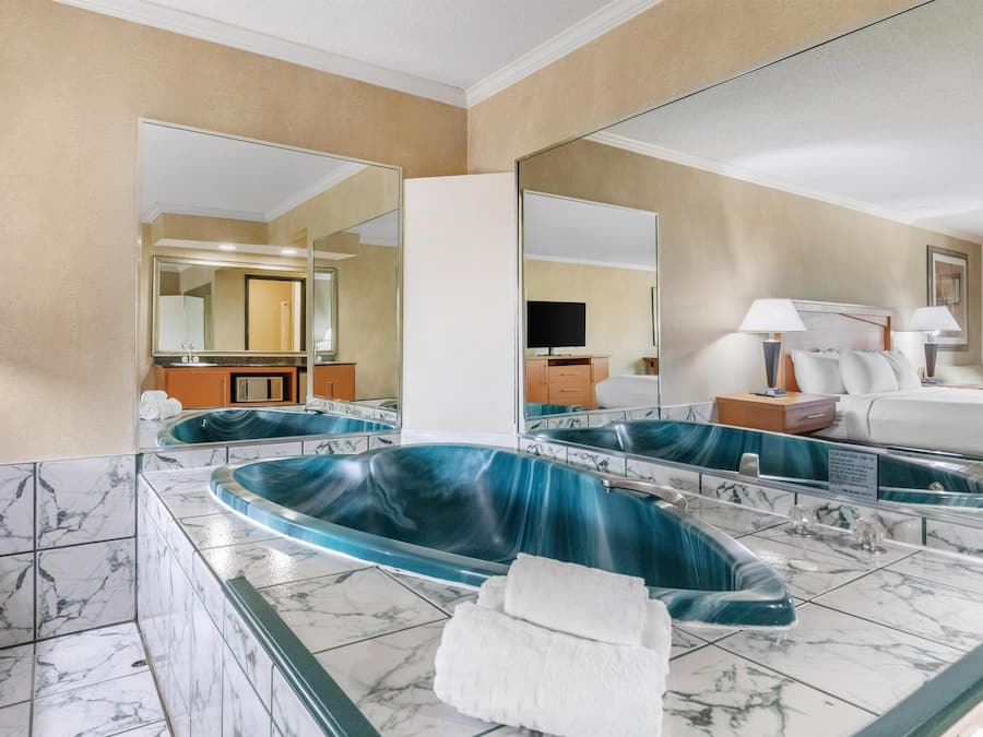 Suite, 1 King Bed, Non Smoking, Jetted Tub | Pillowtop beds, desk, laptop workspace, iron/ironing board