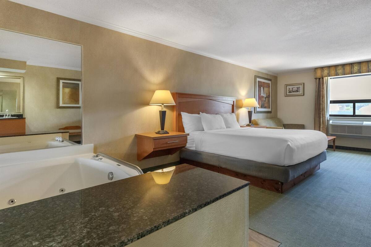 Suite, 1 King Bed, Accessible, Jetted Tub (with Sofabed) | Pillowtop beds, desk, laptop workspace, iron/ironing board