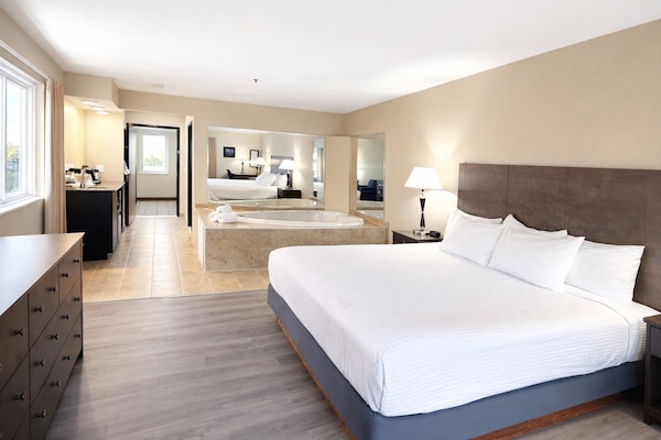 Suite, 1 King Bed, Non Smoking, Jetted Tub (with Sofabed) | Pillowtop beds, desk, laptop workspace, iron/ironing board