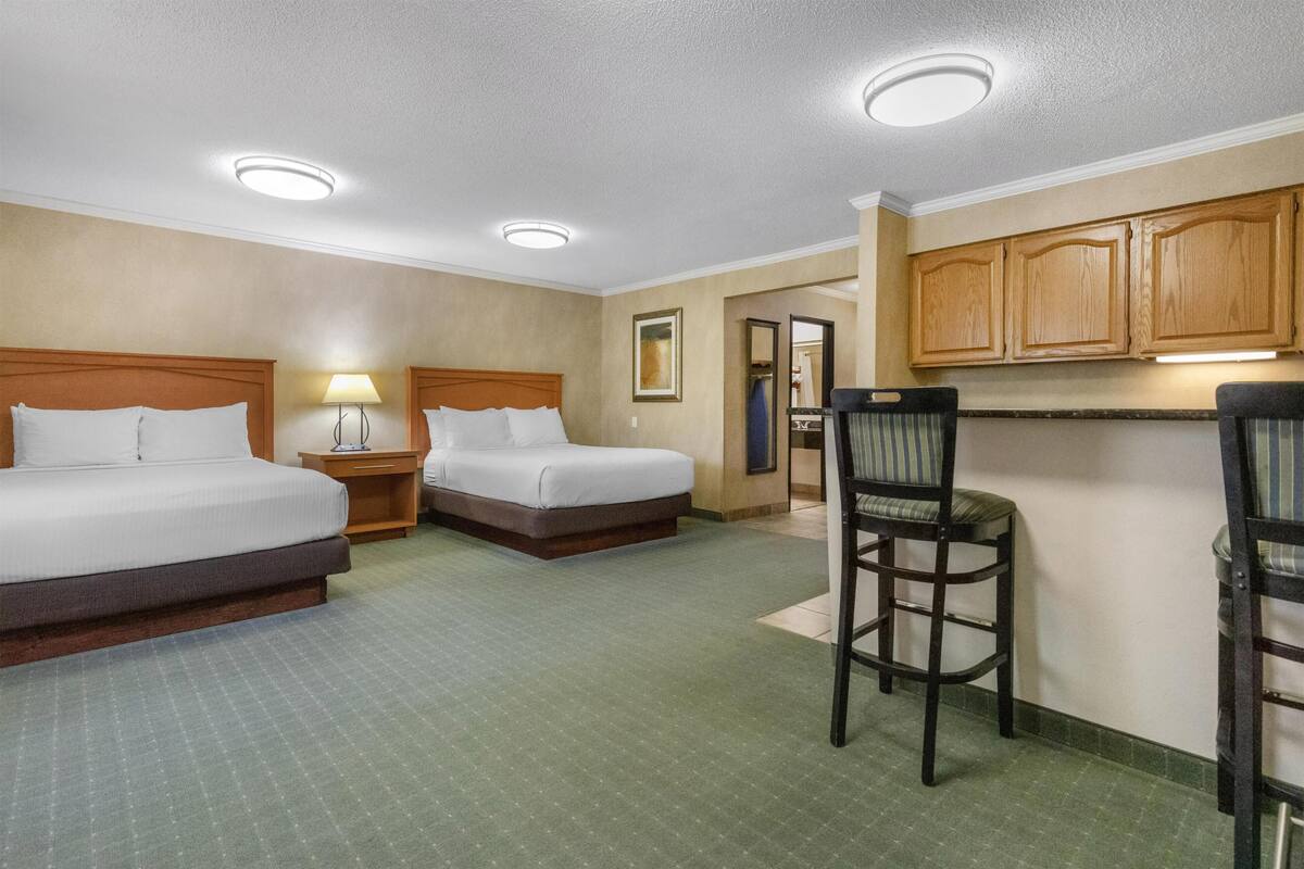 Suite, 2 Queen Beds, Non Smoking, Refrigerator & Microwave | Pillowtop beds, desk, laptop workspace, iron/ironing board