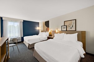 Desk, blackout drapes, iron/ironing board, free cribs/infant beds