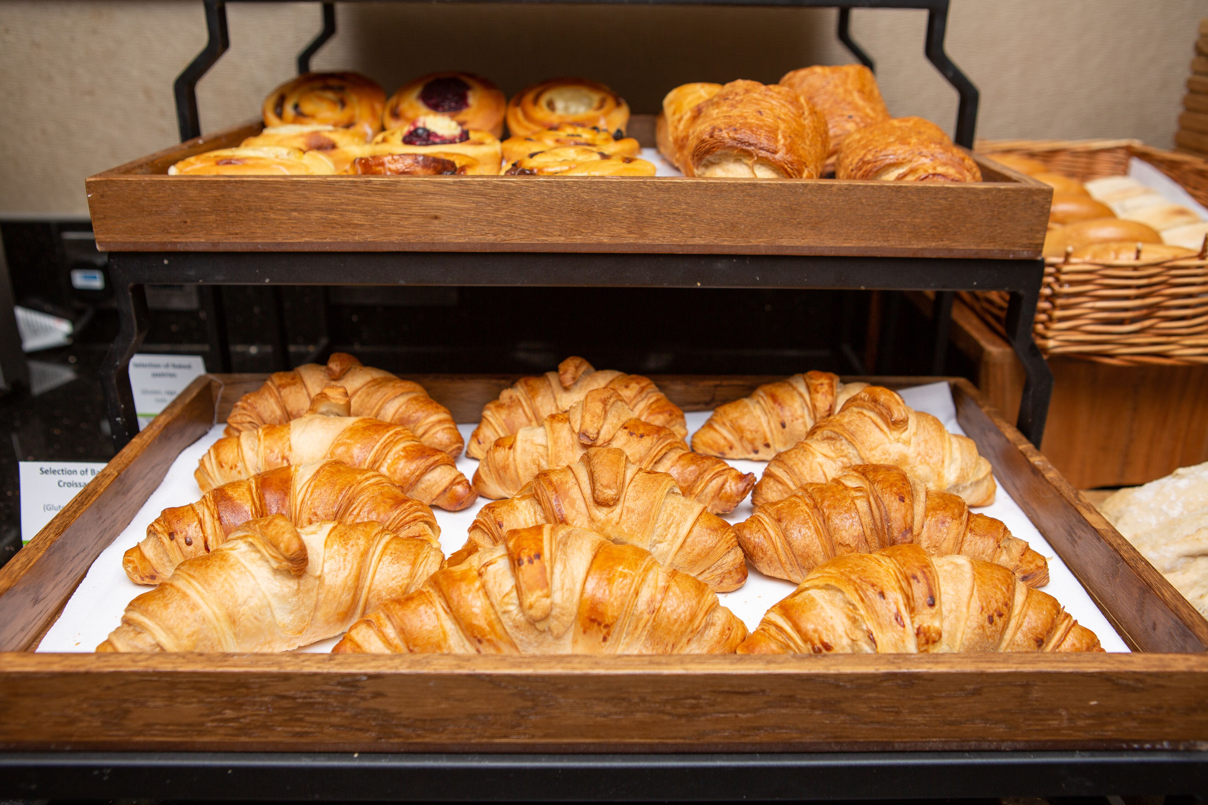 A display of assorted baked goods including croissants and pastries.
