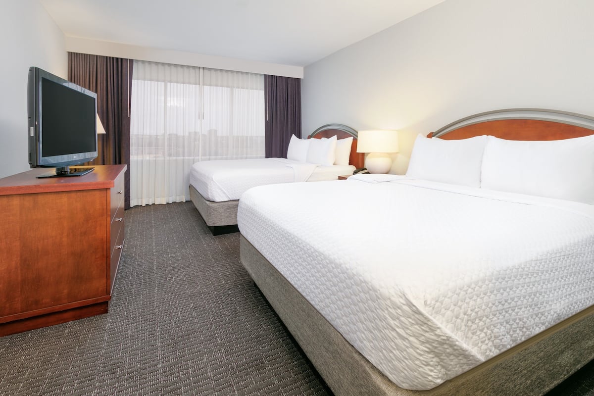 Premium bedding, desk, laptop workspace, iron/ironing board