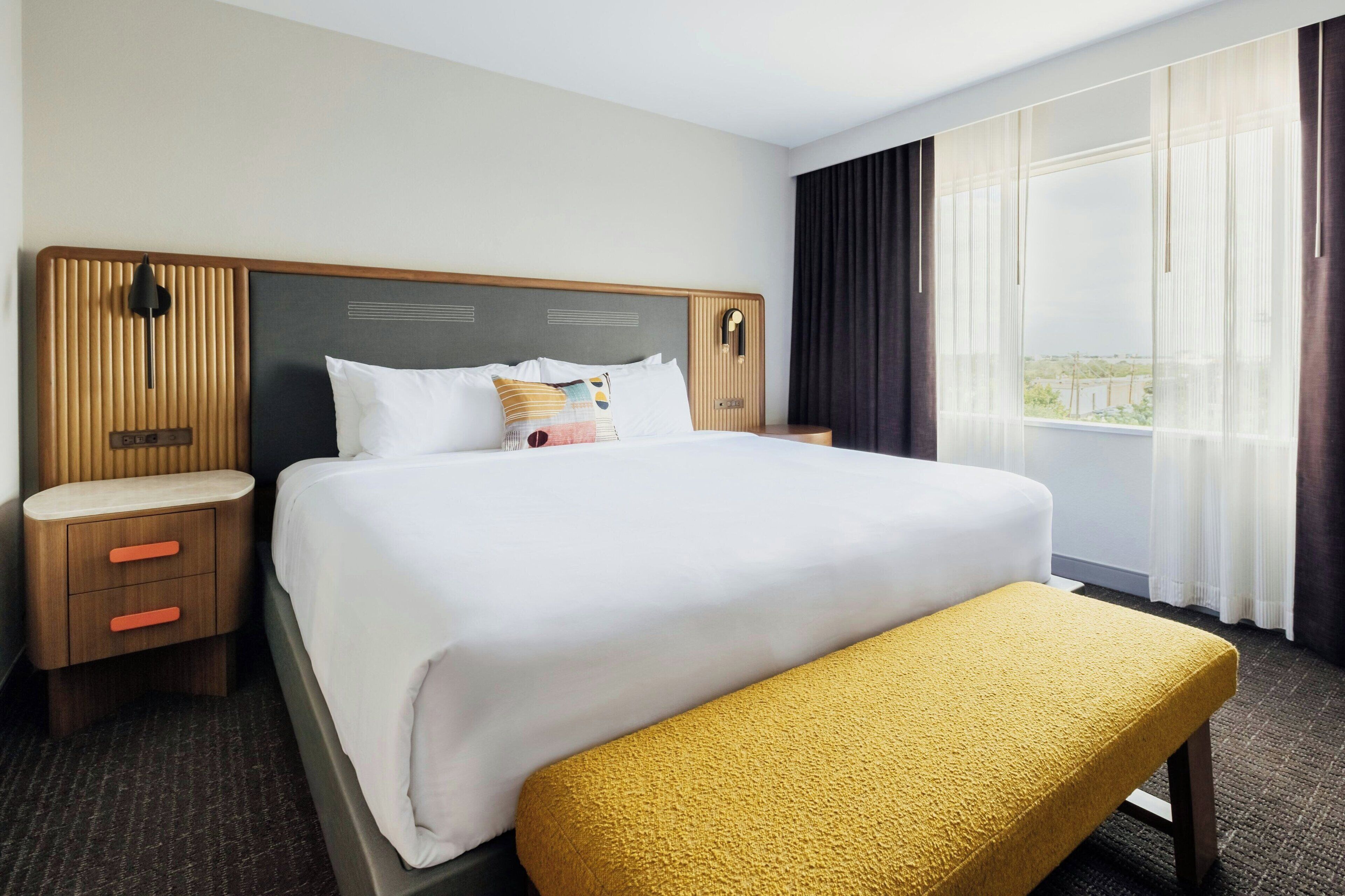 Premium bedding, desk, laptop workspace, iron/ironing board