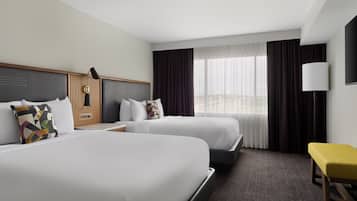 Premium bedding, desk, laptop workspace, iron/ironing board