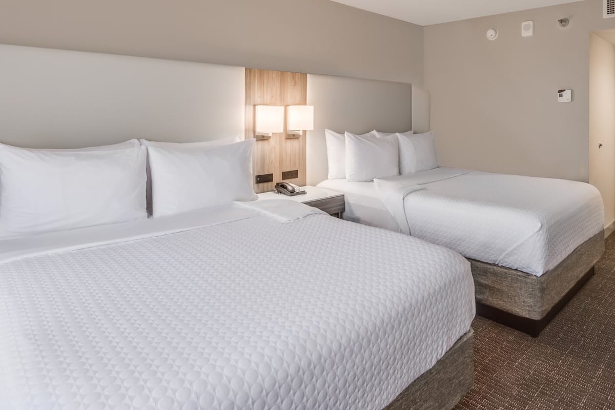 Premium bedding, desk, laptop workspace, iron/ironing board