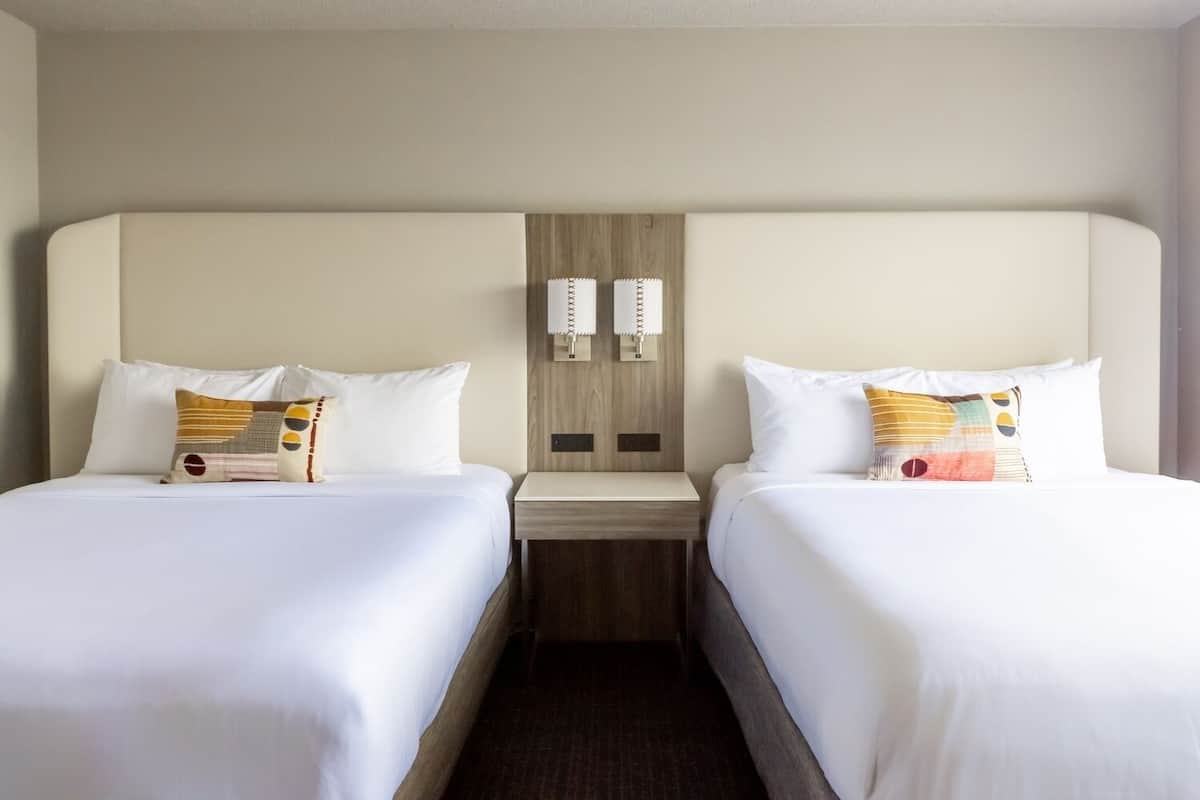 Premium bedding, desk, laptop workspace, iron/ironing board