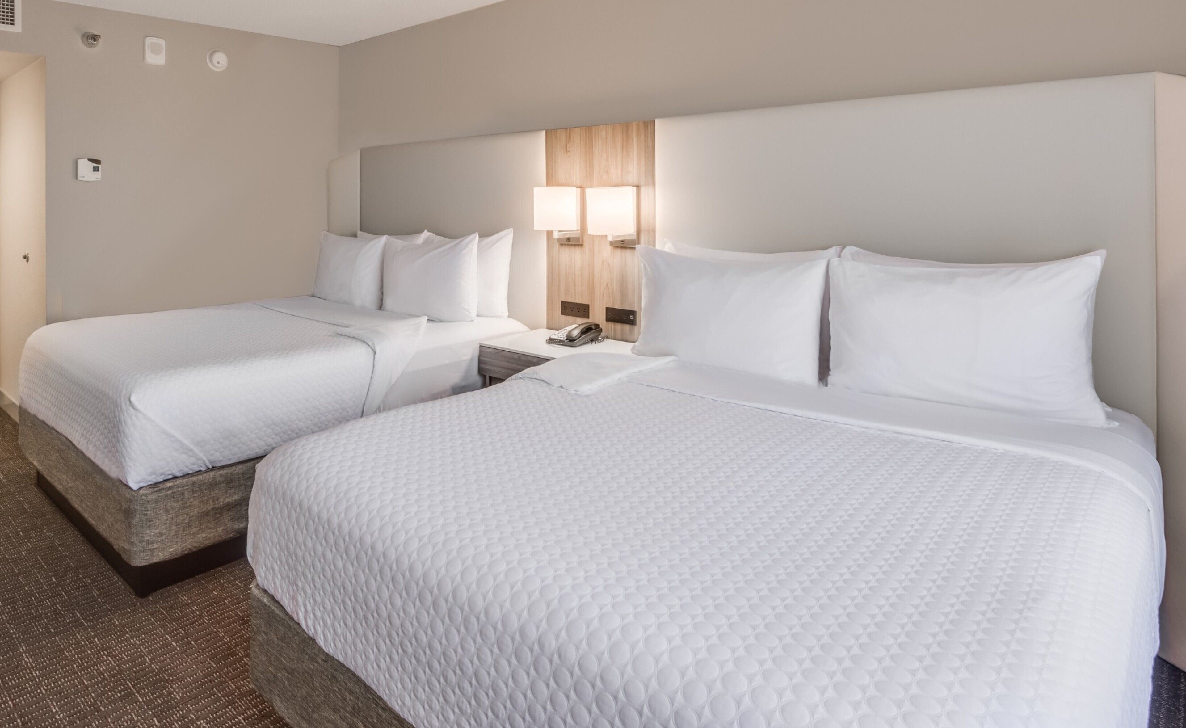 Premium bedding, desk, laptop workspace, iron/ironing board