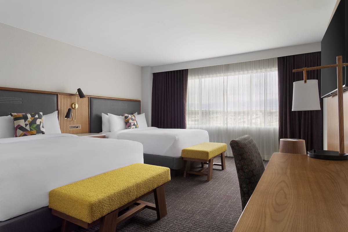 Premium bedding, desk, laptop workspace, iron/ironing board