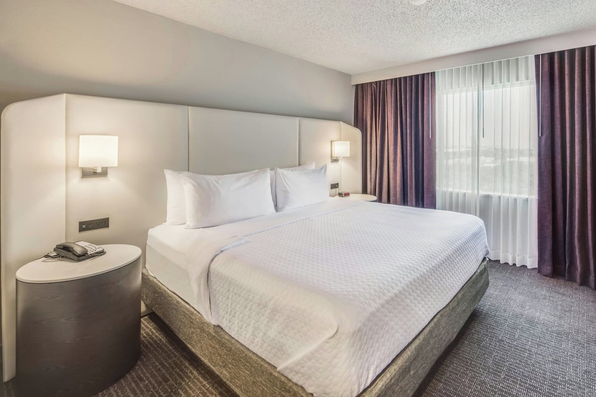 Premium Suite, 1 Bedroom, Non Smoking | Premium bedding, desk, laptop workspace, iron/ironing board